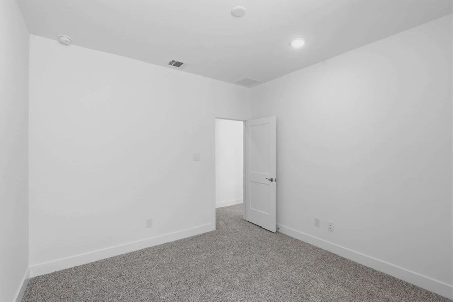 Representative unfurnished interior of a home built from the Chantilly 2 by Chesmar Homes in Sienna Chateau, Missouri City (Image 38).