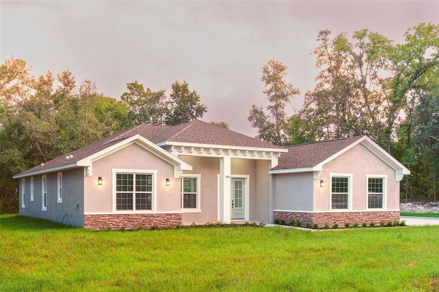 Front exterior of a new home in , Summerfield, FL, highlighting curb appeal (Image 1). Front exterior of a new home in , Summerfield, FL, highlighting curb appeal (Image 1).