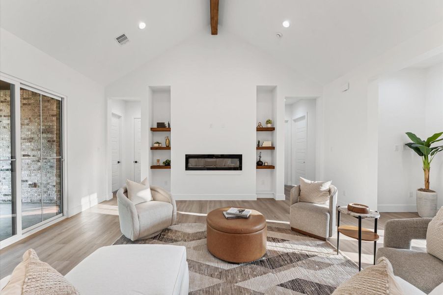 Open-concept living area with soaring cathedral ceilings, large windows for natural light, and LED recessed lighting throughout — a space where luxury meets comfort. Open-concept living area with soaring cathedral ceilings, large windows for natural light, and LED recessed lighting throughout — a space where luxury meets comfort.