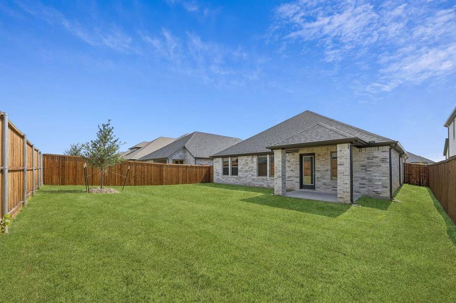 Covered Patio in the Emmy II home plan by Trophy Signature Homes - REPRESENTATIVE PHOTO