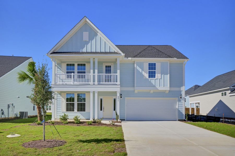 Front exterior of a new home in Grand Park, Leland, NC, highlighting curb appeal (Image 1). Front exterior of a new home in Grand Park, Leland, NC, highlighting curb appeal (Image 1).