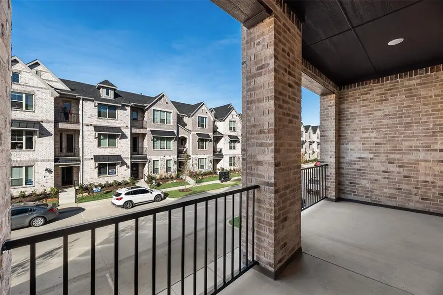 Exterior details and patio area of a home in Wade Settlement Townhomes, Frisco (Image 3).