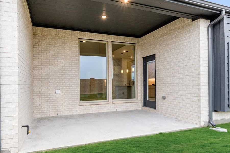 Exterior details and patio area of a home in Villages of Hurricane Creek, Anna (Image 4).