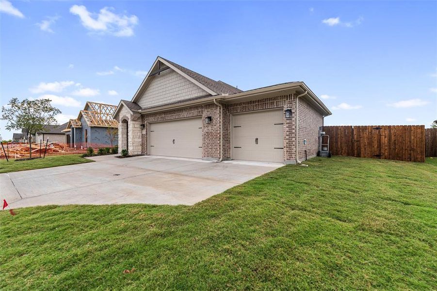 View of front of property featuring concrete driveway, a garage, and brick siding View of front of property featuring concrete driveway, a garage, and brick siding