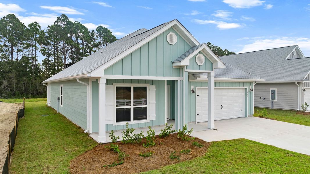 Front exterior of a new home in Buffer Farms, Port Saint Joe, FL, highlighting curb appeal (Image 18).
