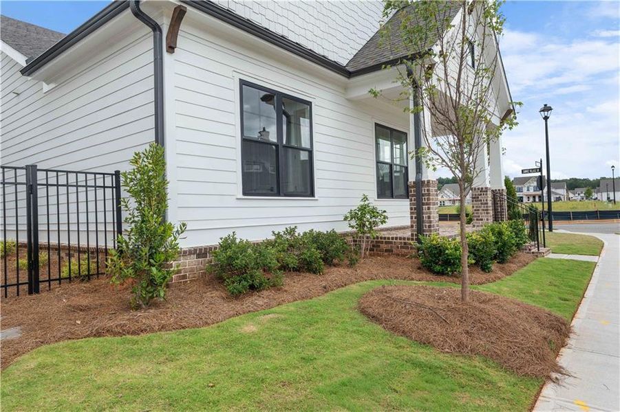 Front exterior of a new home in Promenade at Sawnee Village, Cumming, GA, highlighting curb appeal (Image 19).