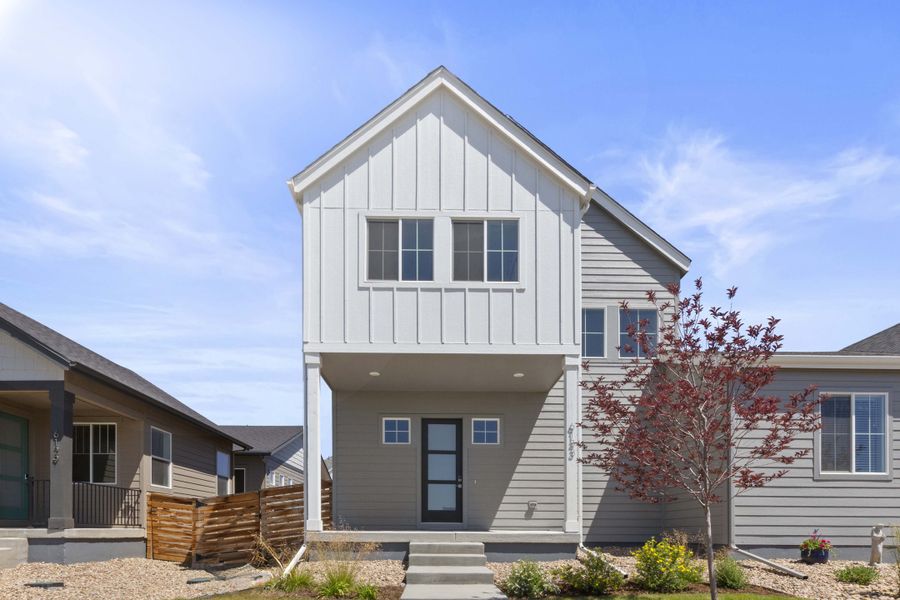Front exterior of a new home in Trailside on Harmony, Timnath, CO, highlighting curb appeal (Image 30).