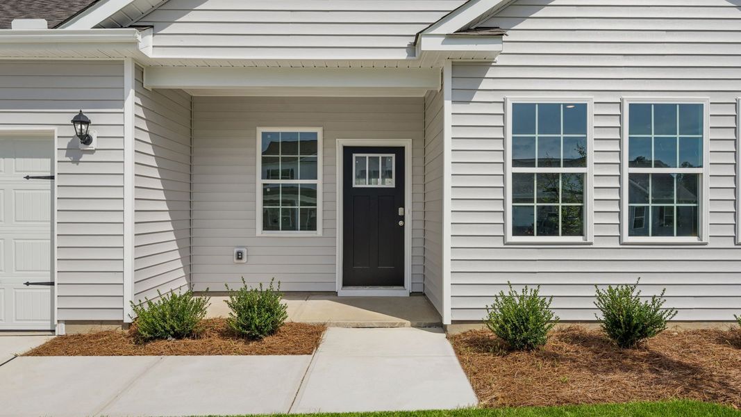 Exterior details and patio area of a home in Tyler - Home on the Lake, New Bern (Image 4).
