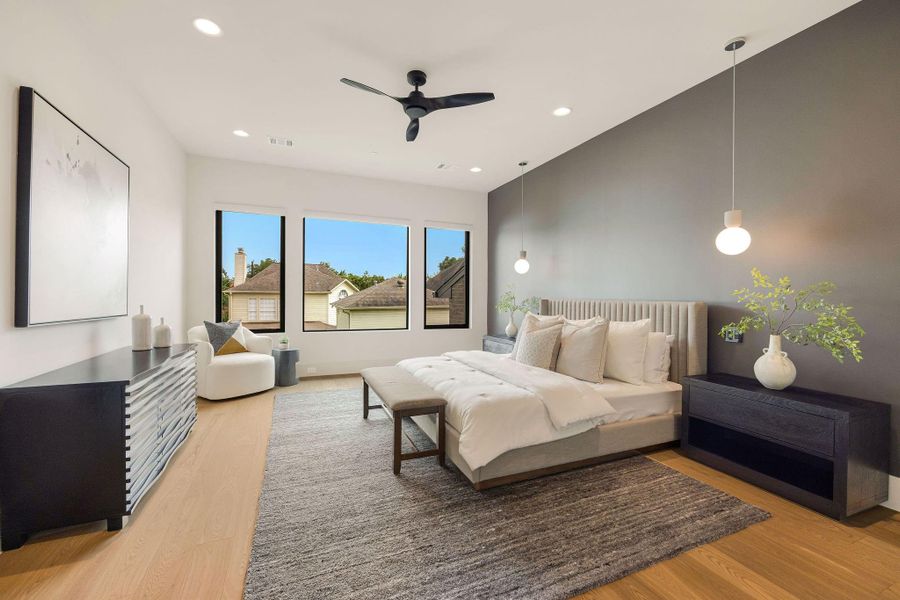 [PRIMARY BEDROOM] The spectacular primary suite is a true sanctuary, showcasing sleek contemporary design, bold architectural details, a stunning accent wall, and exceptional finishes that evoke the elegance of a luxury California residence.