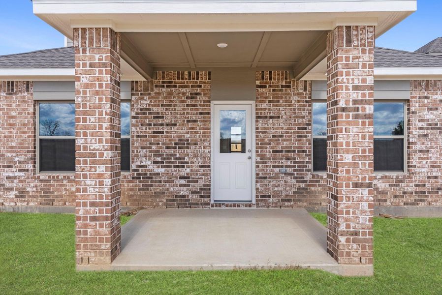 Exterior details and patio area of a home in Windrose Green, Angleton (Image 3).