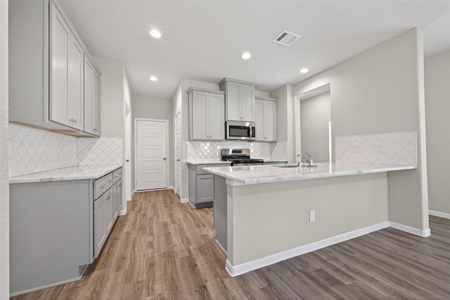 Furnished interior view inside a new home in Woodland Lakes, Huffman (Image 6).