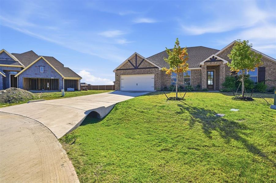 Front exterior of a new home in Wildcat Ridge, Godley, TX, highlighting curb appeal (Image 24). Front exterior of a new home in Wildcat Ridge, Godley, TX, highlighting curb appeal (Image 24).