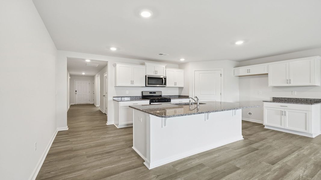Furnished interior view inside a new home in Bentley Park, Greenwood (Image 5).