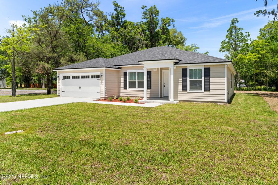Front exterior of a new home in , Jacksonville, FL, highlighting curb appeal (Image 18). Front exterior of a new home in , Jacksonville, FL, highlighting curb appeal (Image 18).