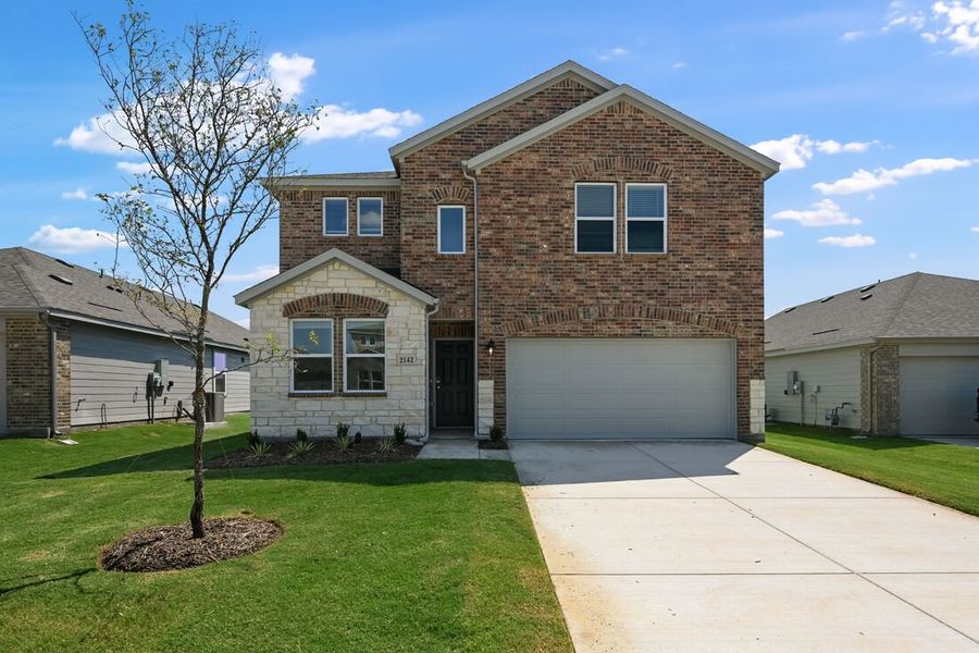 Front exterior of a new home in River Ridge, Crandall, TX, highlighting curb appeal (Image 1). Front exterior of a new home in River Ridge, Crandall, TX, highlighting curb appeal (Image 1).