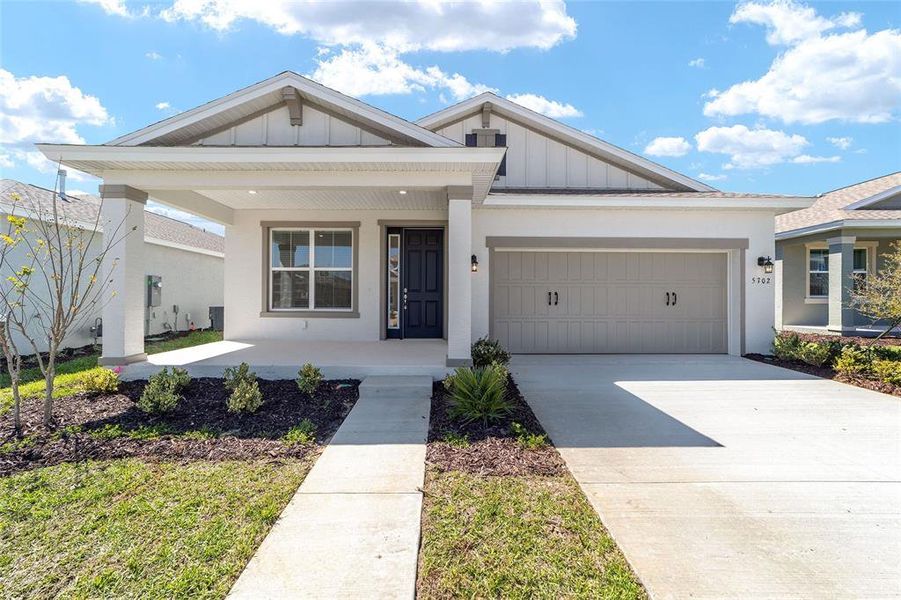 Front exterior of a new home in Calesa Township, Ocala, FL, highlighting curb appeal (Image 23).