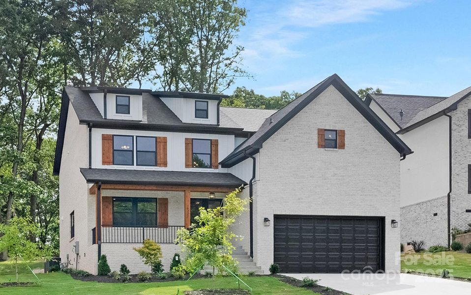 Front exterior of a new home in , Charlotte, NC, highlighting curb appeal (Image 1).