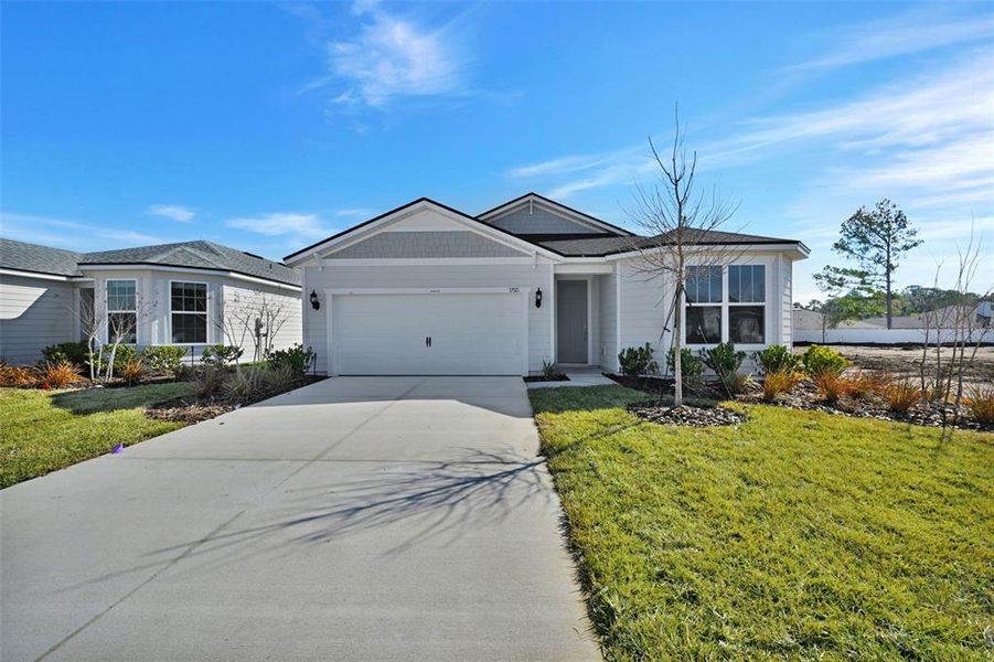Front exterior of a new home in Lakeview Estates, Palm Coast, FL, highlighting curb appeal (Image 2). Front exterior of a new home in Lakeview Estates, Palm Coast, FL, highlighting curb appeal (Image 2).