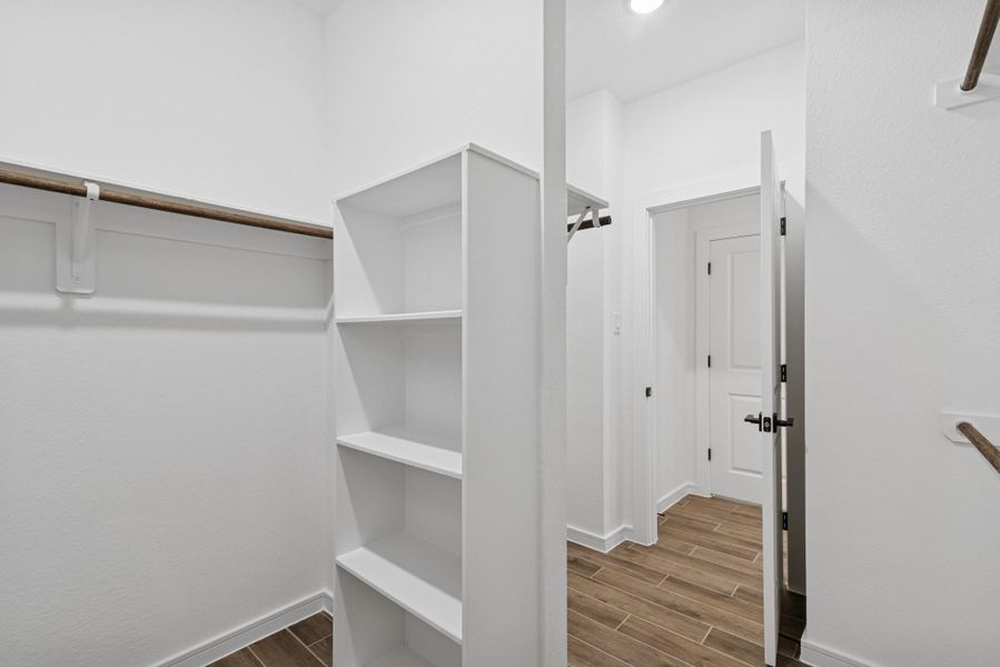 Primary walk-in closet Primary walk-in closet