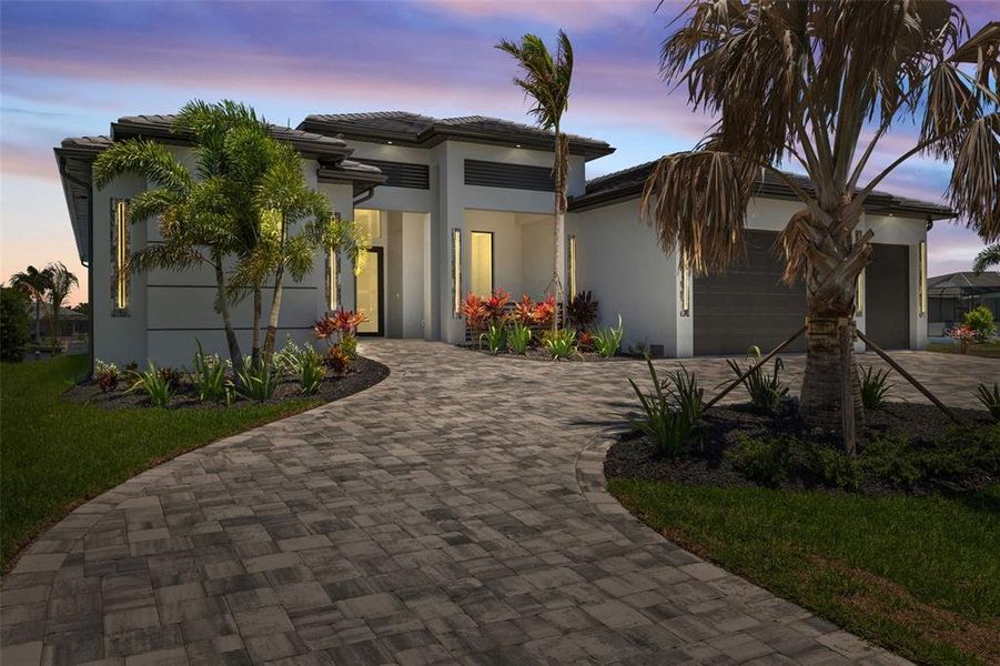 Front exterior of a new home in , Cape Coral, FL, highlighting curb appeal (Image 24).