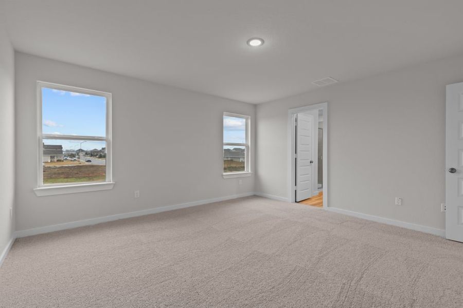 A room with a window and a carpet. A room with a window and a carpet.