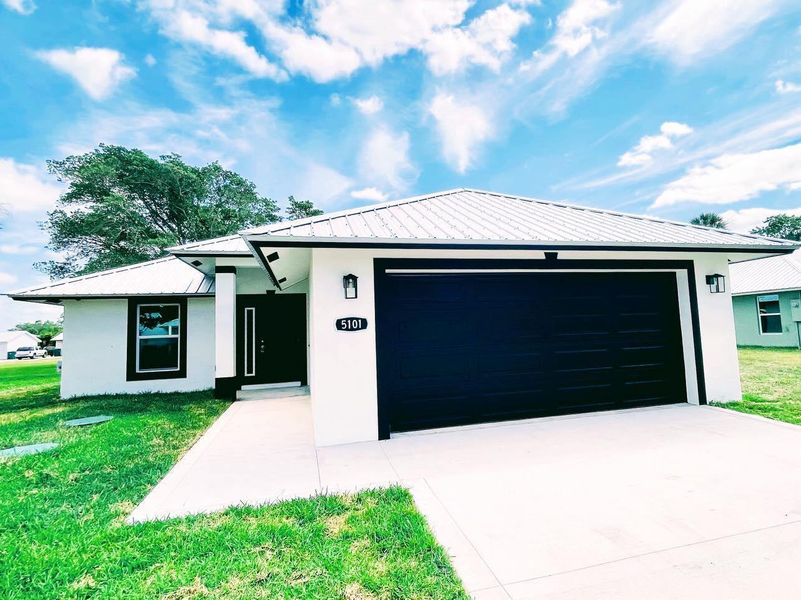 Front exterior of a new home in , Okeechobee, FL, highlighting curb appeal (Image 2).