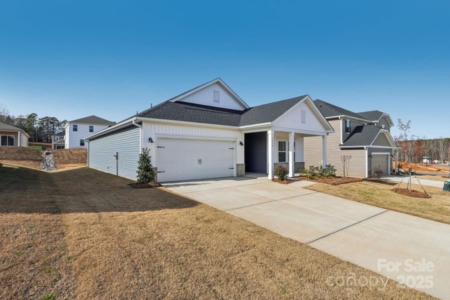 Front exterior of a new home in Harper Landing, Stanley, NC, highlighting curb appeal (Image 25).