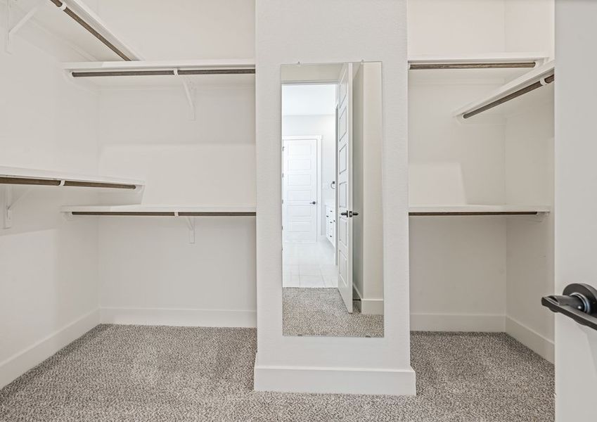 The master closet has plenty of haning and shelf space.