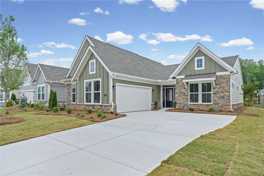 Front exterior of a new home in Laurel Farms, Dallas, GA, highlighting curb appeal (Image 19). Front exterior of a new home in Laurel Farms, Dallas, GA, highlighting curb appeal (Image 19).