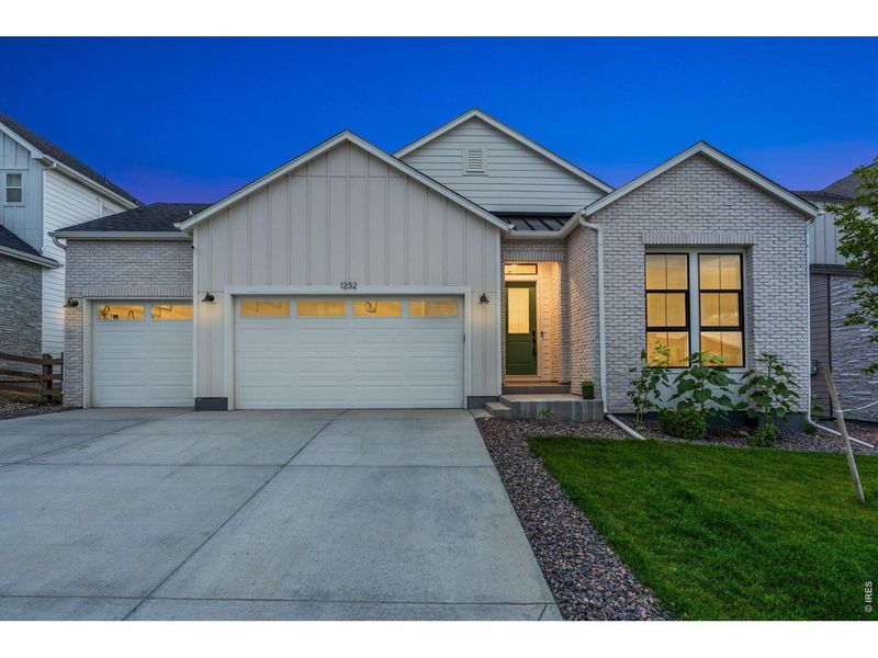 Front exterior of a new home in , Timnath, CO, highlighting curb appeal (Image 1). Front exterior of a new home in , Timnath, CO, highlighting curb appeal (Image 1).