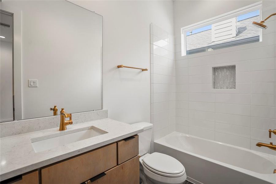 Secondary en-suite bathroom on the second floor.