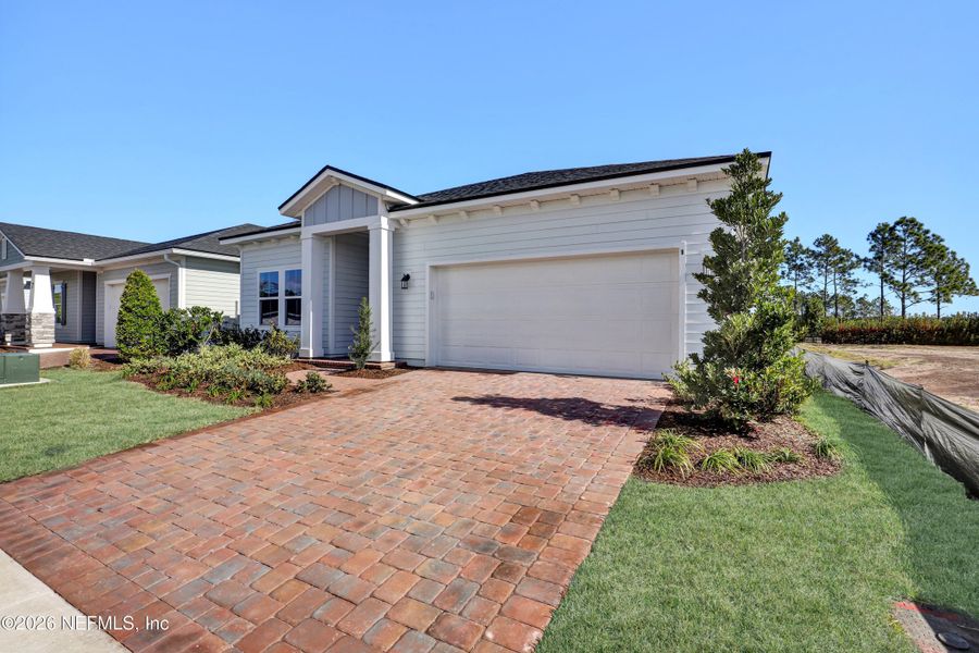 Front exterior of a new home in New 55+ Active Adult Community in Palm Coast, Florida, Palm Coast, FL, highlighting curb appeal (Image 15).