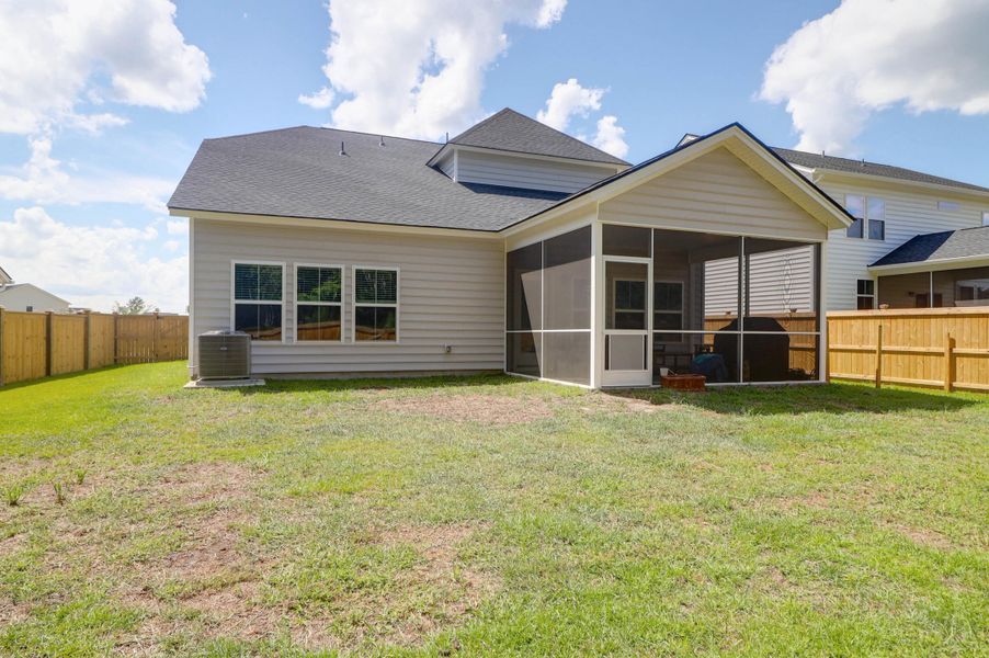 Exterior details and patio area of a home in Sweetgrass at Summers Corner: Arbor Collection, Summerville (Image 30).