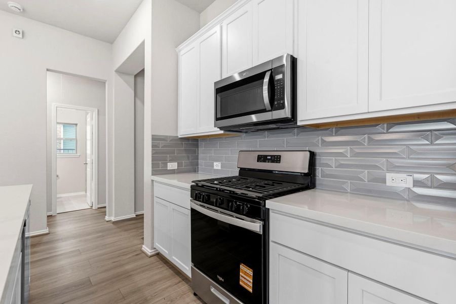 Furnished interior view inside a new home in Bridgeland, Cypress (Image 8).