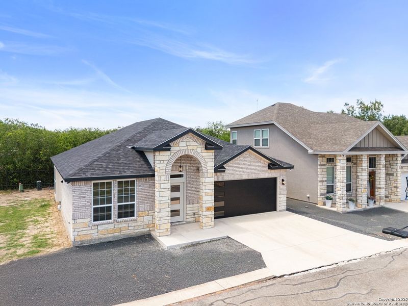 Front exterior of a new home in , Uvalde, TX, highlighting curb appeal (Image 1). Front exterior of a new home in , Uvalde, TX, highlighting curb appeal (Image 1).