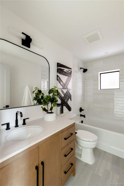 Bathroom adjacent to Third Bedroom and Family Room