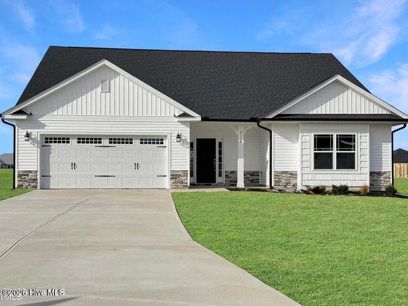 Front exterior of a new home in East Lake, Leland, NC, highlighting curb appeal (Image 1). Front exterior of a new home in East Lake, Leland, NC, highlighting curb appeal (Image 1).