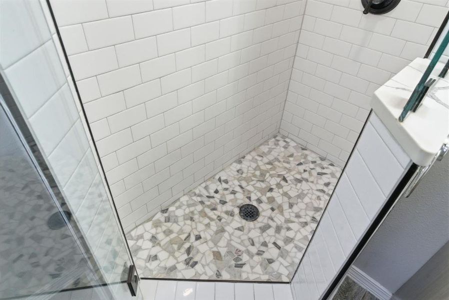 Bathroom featuring a stall shower Bathroom featuring a stall shower