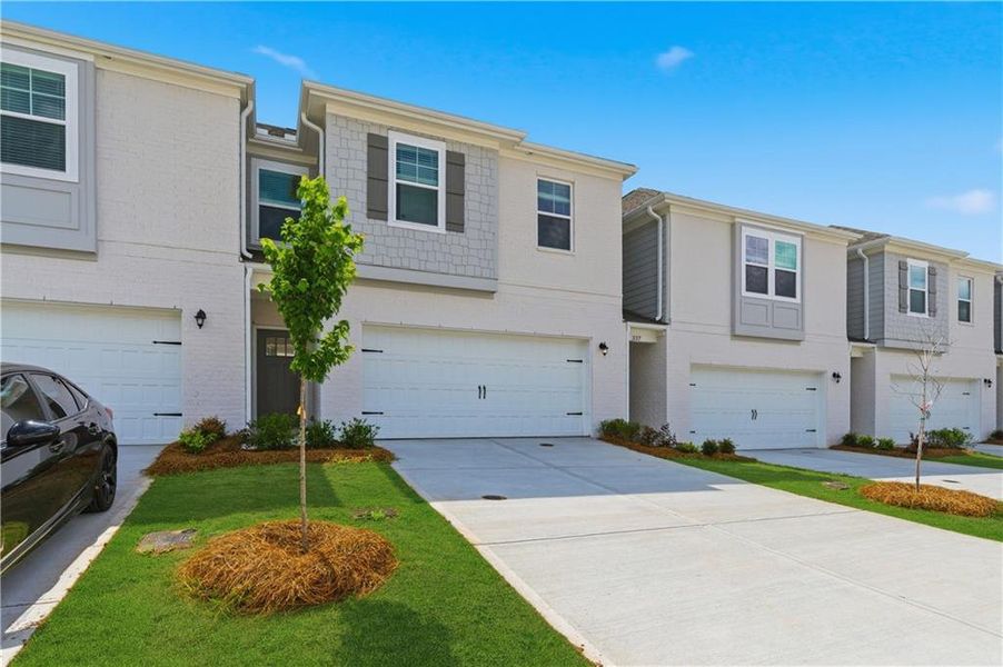Front exterior of a new home in Bowers Farm, McDonough, GA, highlighting curb appeal (Image 17).