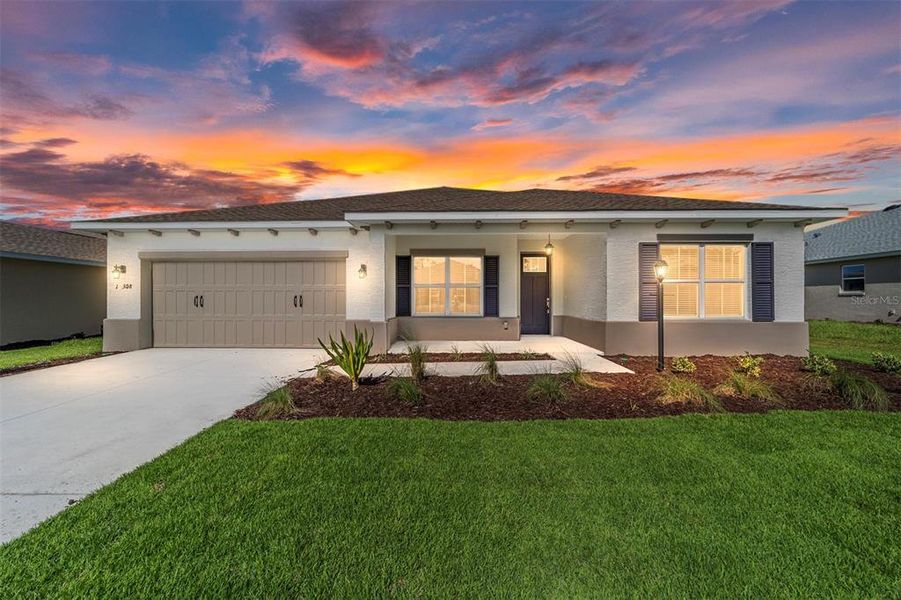 Front exterior of a new home in On Top of the World Communities, Ocala, FL, highlighting curb appeal (Image 2).