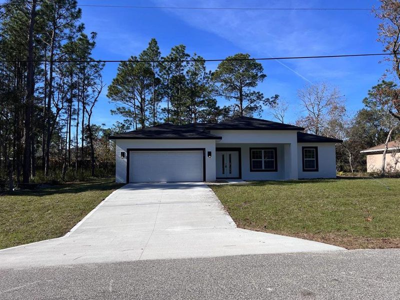 Front exterior of a new home in , Citrus Springs, FL, highlighting curb appeal (Image 2). Front exterior of a new home in , Citrus Springs, FL, highlighting curb appeal (Image 2).