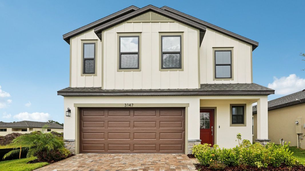 Representative exterior photo of a completed home built from the Naples by DRB Homes in Grasslands West, Lakeland, FL (Image 20).