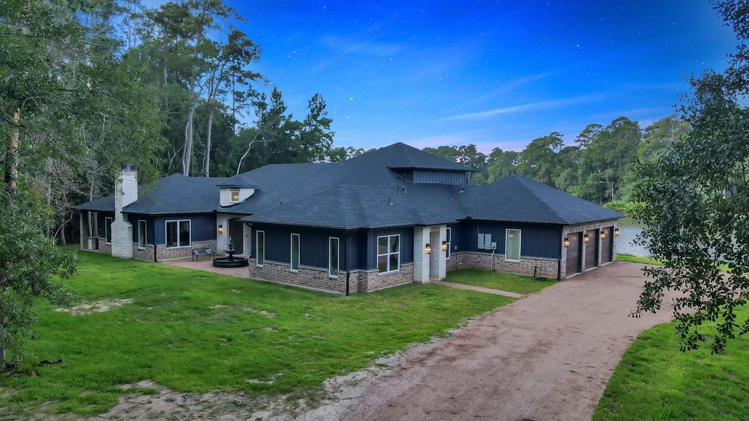 Granite driveway leads to an insulated 4 car garage.