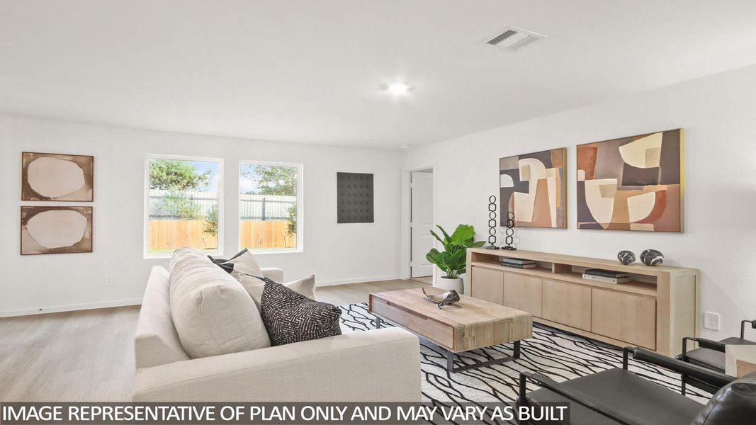 Living room with baseboards and light wood finished floors