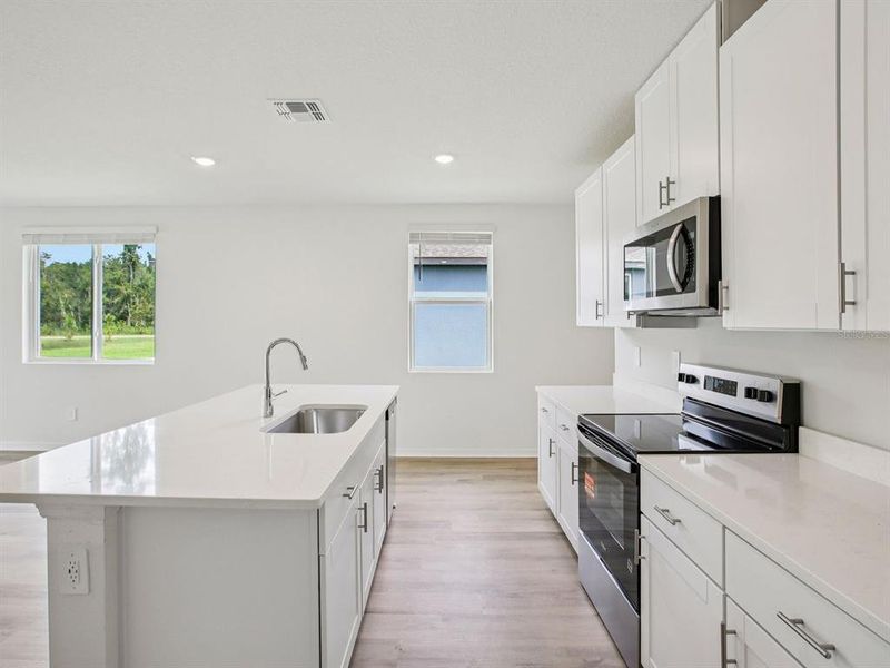 Furnished interior view inside a new home in Oakfield Trails - Premier Series, Parrish (Image 6).
