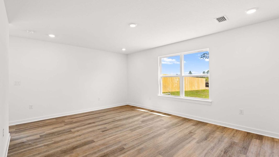 Spacious, unfurnished interior of a new home in Magnolia at the Bluffs Phase 3, Freeport (Image 9).
