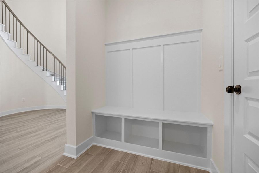 Mudroom with wood finished floors and baseboards Mudroom with wood finished floors and baseboards