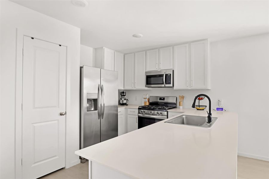 Great layout for the kitchen. Pantry for storage and granite counters.
