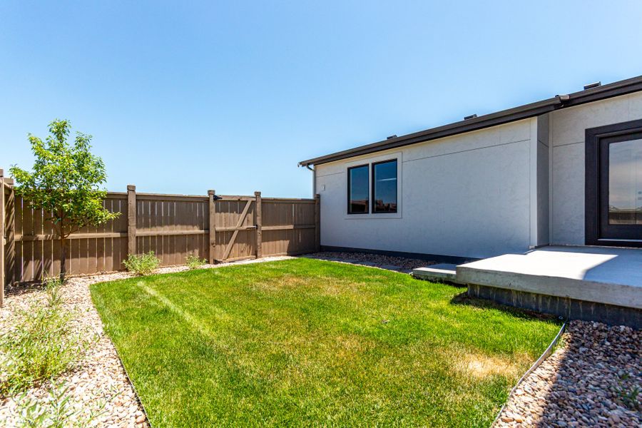 Exterior details and patio area of a home in West Grange, Longmont (Image 26).