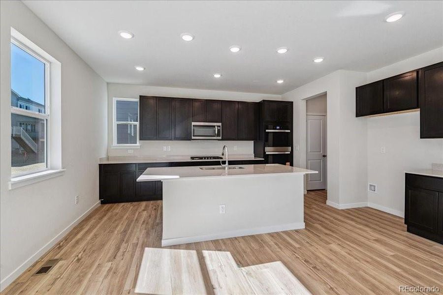 Furnished interior view inside a new home in Floret Collection at Alder Creek, Parker (Image 8).